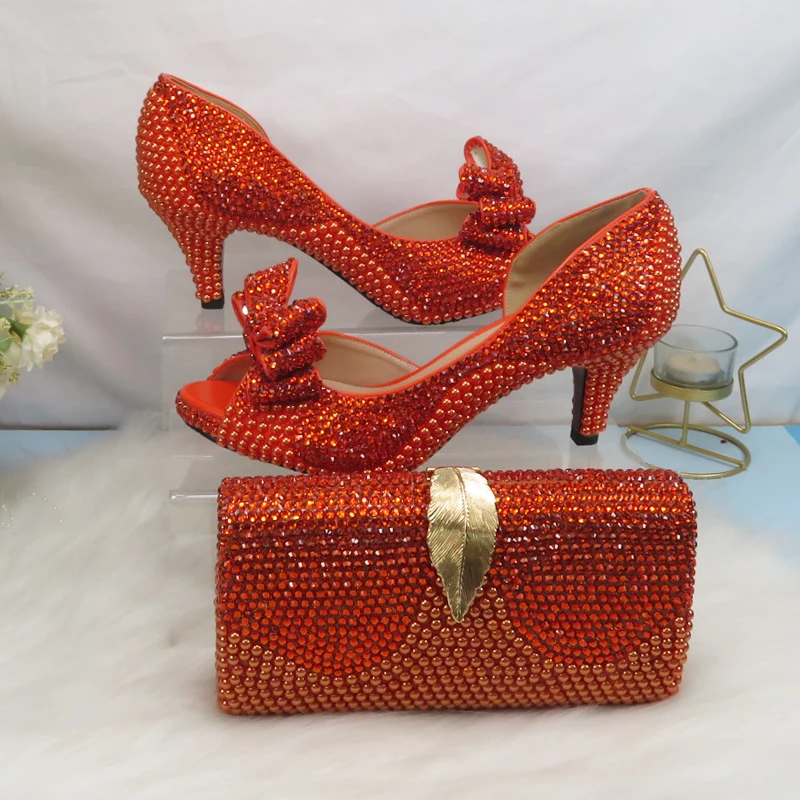 2021 New arrival Orange Crystal Women wedding shoes with matching bags Peep toe High Pumps fashion Open Toe shoes and Purse
2021 New arrival Orange Crystal Women wedding shoes with matching bags Peep toe High Pumps fashion Open Toe shoes and Purse