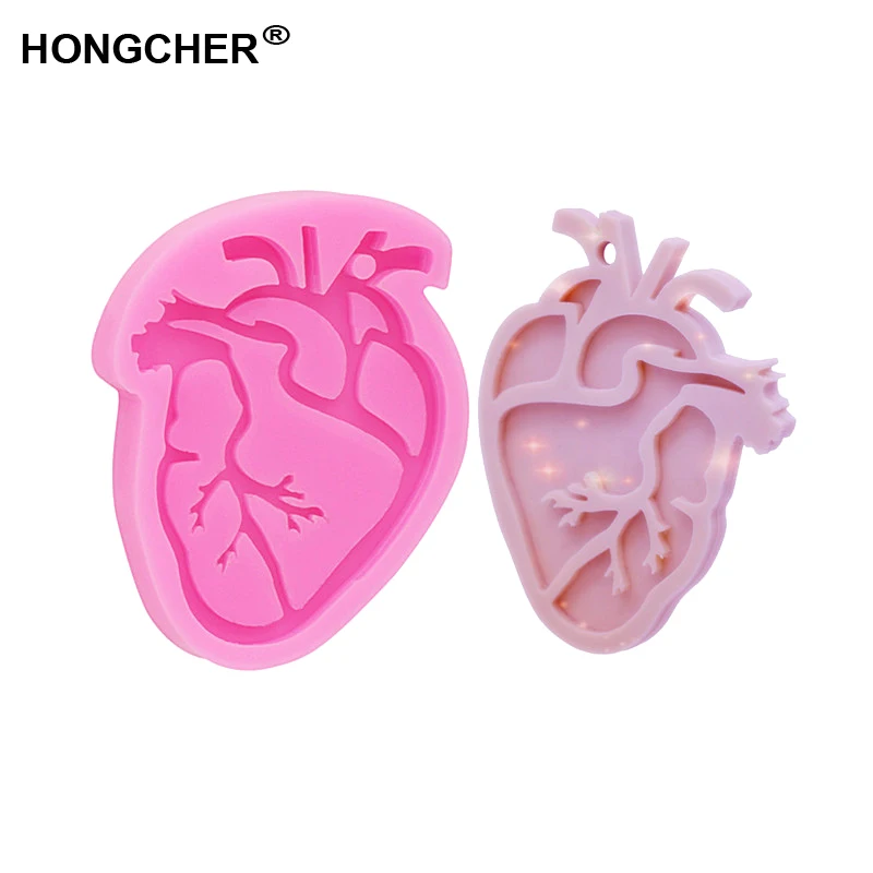 New Shiny organ heart shape European and American fashion pendant mold key ring earring mould gadget epoxy resin
New Shiny organ heart shape European and American fashion pendant mold key ring earring mould gadget epoxy resin