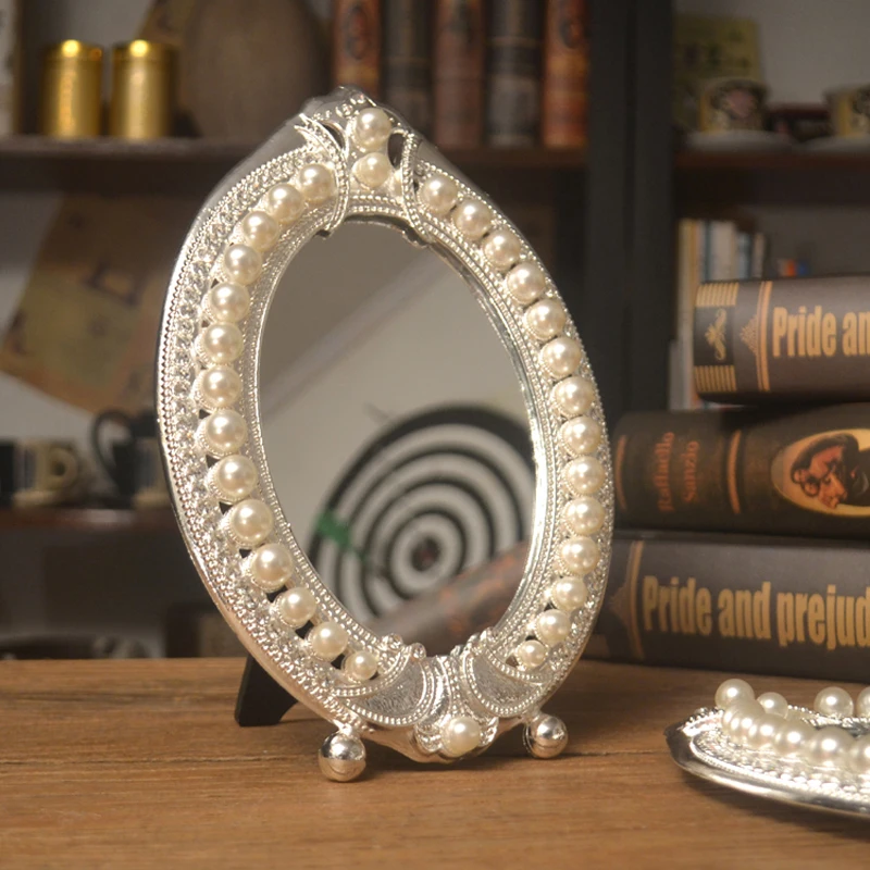 Silver Pearls Jeweled Metal Tabletop Mirror European Gold Antique Brass Copper Oval Footed Single Sided Alloy Standing Mirrors
Silver Pearls Jeweled Metal Tabletop Mirror European Gold Antique Brass Copper Oval Footed Single Sided Alloy Standing Mirrors