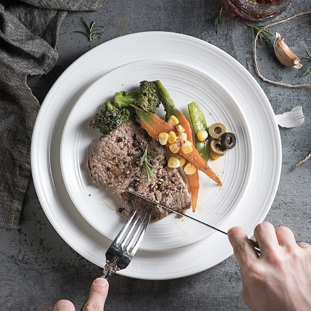 Simple round ceramic plate household line pattern steak plate pasta flat plate hotel western restaurant tableware customization
Simple round ceramic plate household line pattern steak plate pasta flat plate hotel western restaurant tableware customization