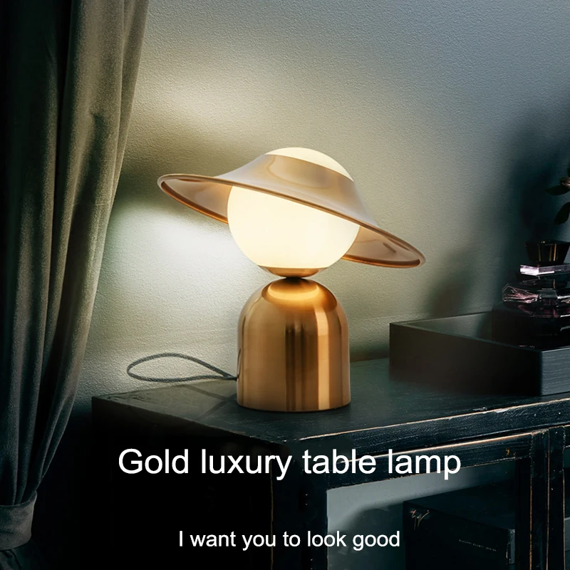 Table lamp light luxury desktop bedroom bedside creative minimalist hat lamp metal post-modern Nordic living room art decoration
Table lamp light luxury desktop bedroom bedside creative minimalist hat lamp metal post-modern Nordic living room art decoration