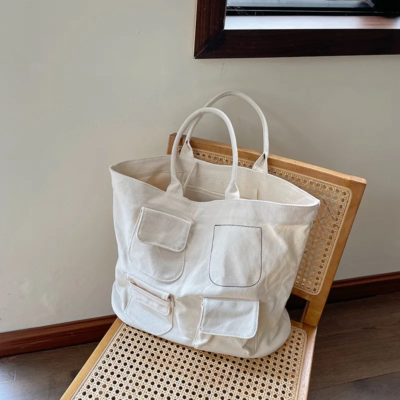 Large-capacity Canvas Handbag Multi-pocket Single Shoulder Tote Bag Fashion Japanese Solid Color Trend Casual
Large-capacity Canvas Handbag Multi-pocket Single Shoulder Tote Bag Fashion Japanese Solid Color Trend Casual