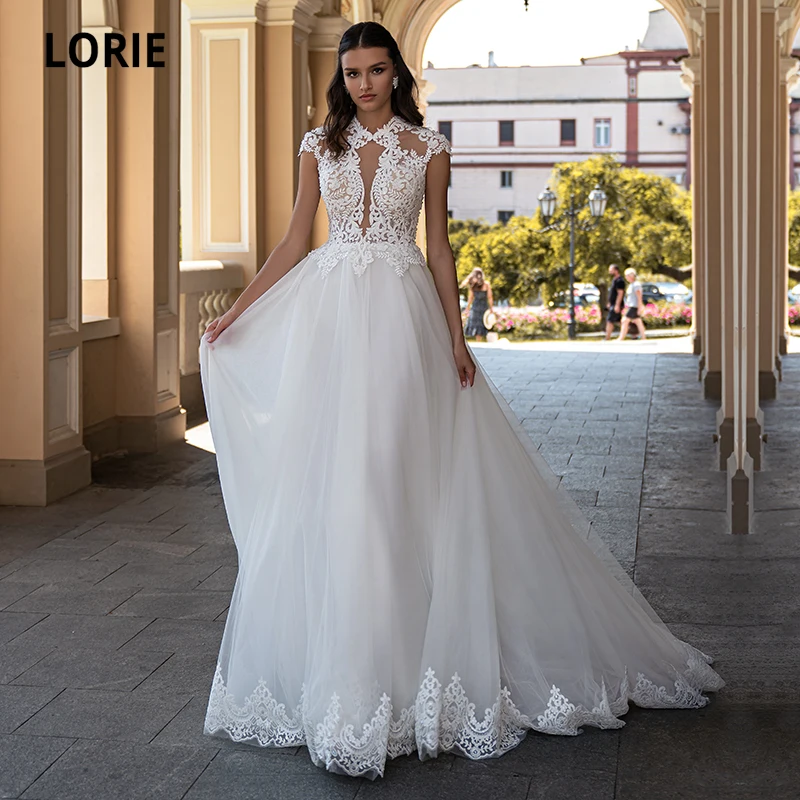 LORIE Arabic Wedding Dresses 2021 O-Neck Appliques Lace Cap Sleeves A-Line Boho Wedding Gown Bride Dress robe de mariée bohème
LORIE Arabic Wedding Dresses 2021 O-Neck Appliques Lace Cap Sleeves A-Line Boho Wedding Gown Bride Dress robe de mariée bohème