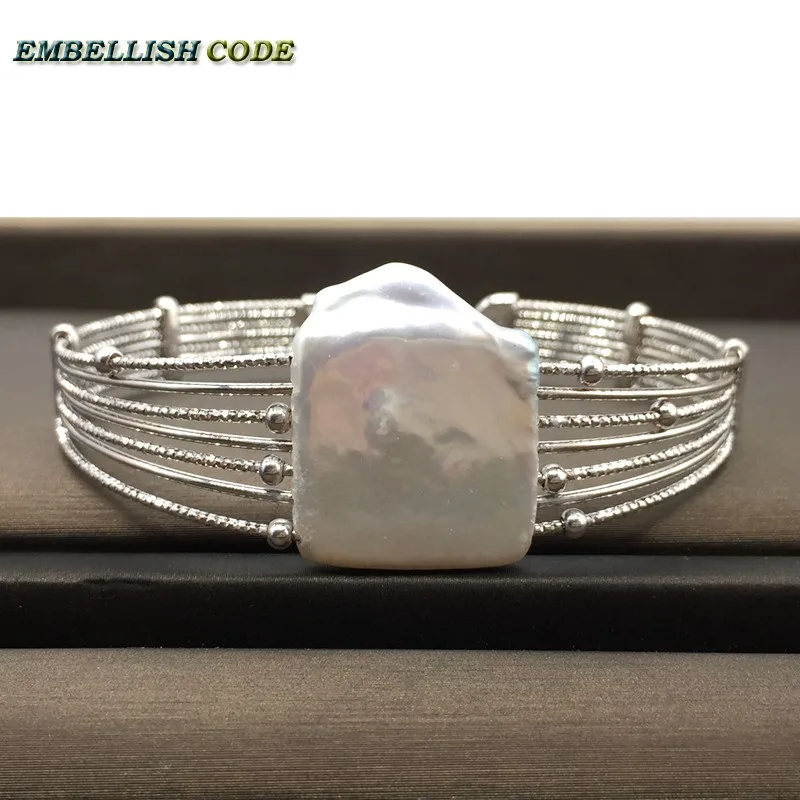NEW silver with block shape pearls hand made baroque pearl bracelet Designer pieces
NEW silver with block shape pearls hand made baroque pearl bracelet Designer pieces