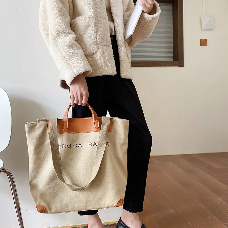 Women's large-capacity tote leather patchwork shopping bag casual canvas handbag designer letter one-shoulder messenger bag
Women's large-capacity tote leather patchwork shopping bag casual canvas handbag designer letter one-shoulder messenger bag
