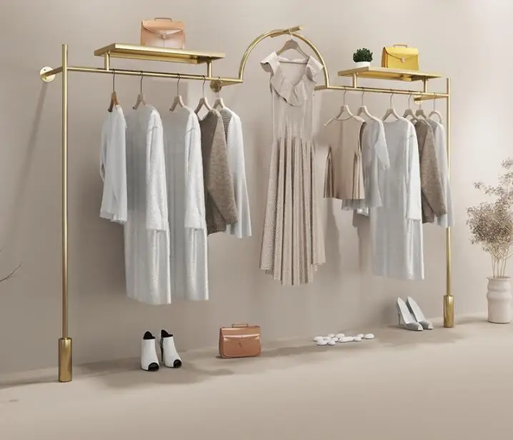 Stainless steel and titanium clothes shelf hanging on the wall of clothing store display shelf
Stainless steel and titanium clothes shelf hanging on the wall of clothing store display shelf
