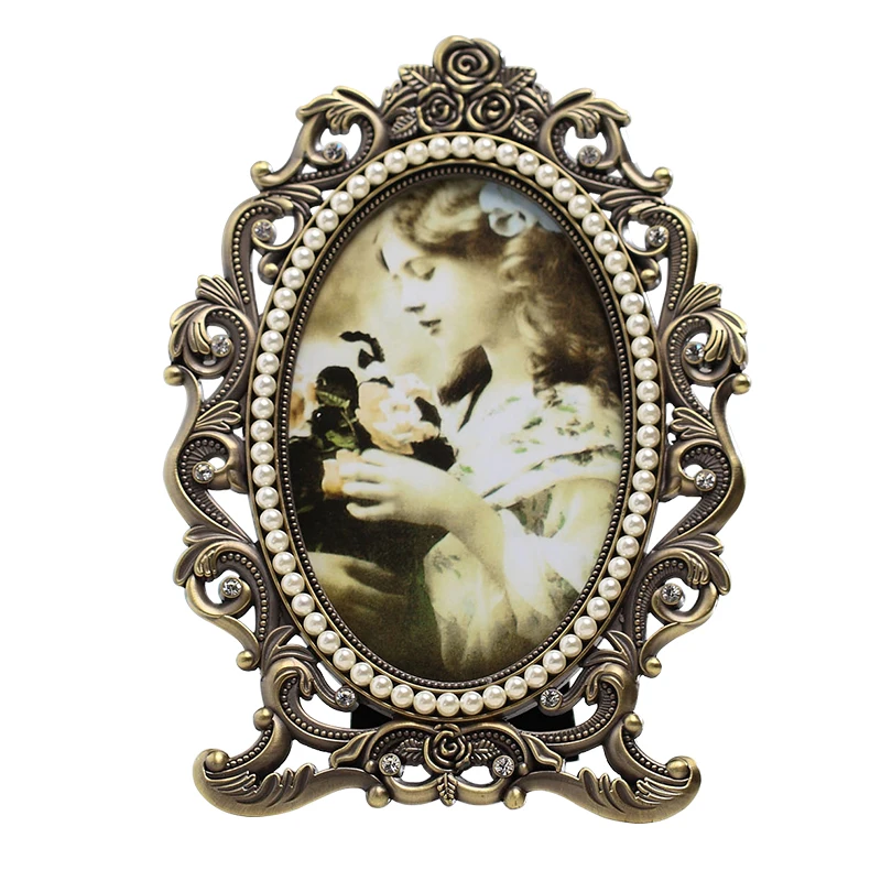 European Antique Brass Silver Plating Hollow Rose Flower With White Pearls Inlaid 4x6, 5x7 Inches Oval Footed Metal Photo Frame
European Antique Brass Silver Plating Hollow Rose Flower With White Pearls Inlaid 4x6, 5x7 Inches Oval Footed Metal Photo Frame
