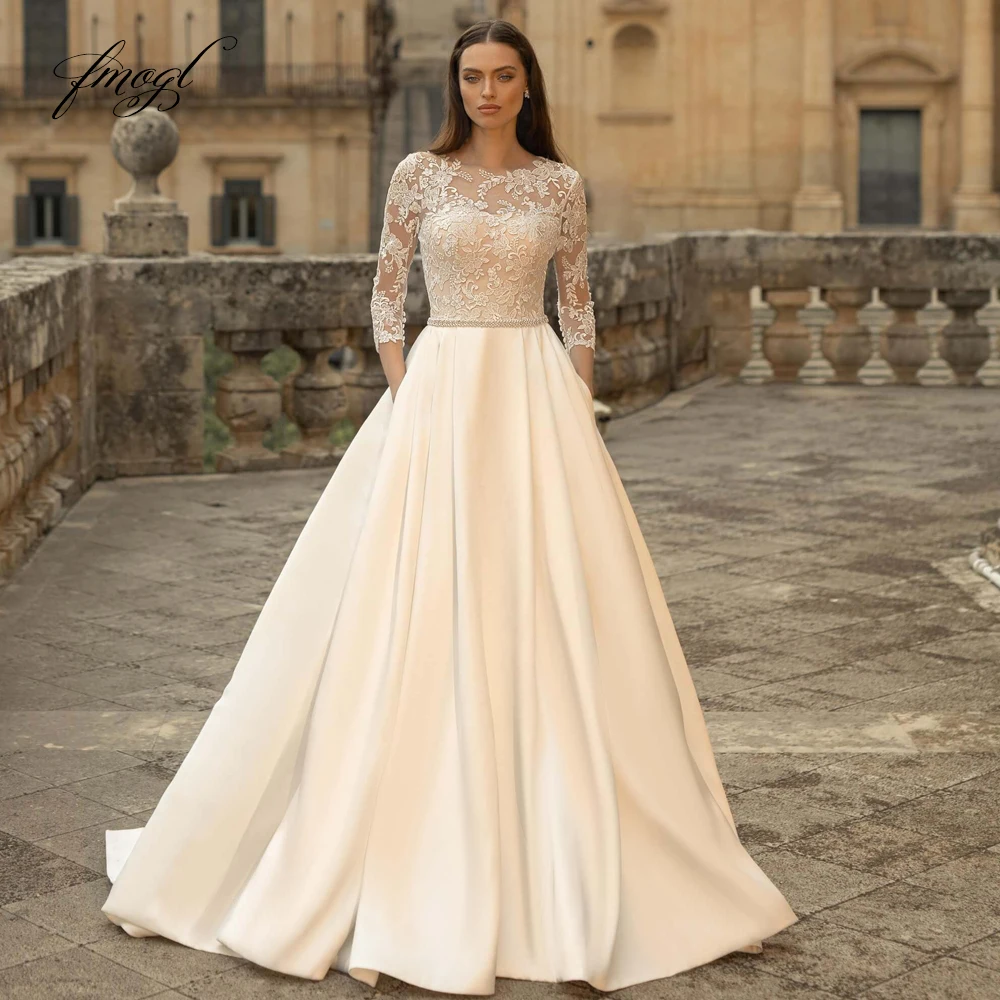 Fmogl Vestidos De Noiva сексуальное кружевное винтажное свадебное платье с открытой спиной три четверти с аппликацией из бисера и поясом трапециевидное платье невесты
Fmogl Vestidos De Noiva сексуальное кружевное винтажное свадебное платье с открытой спиной три четверти с аппликацией из бисера и поясом трапециевидное платье невесты