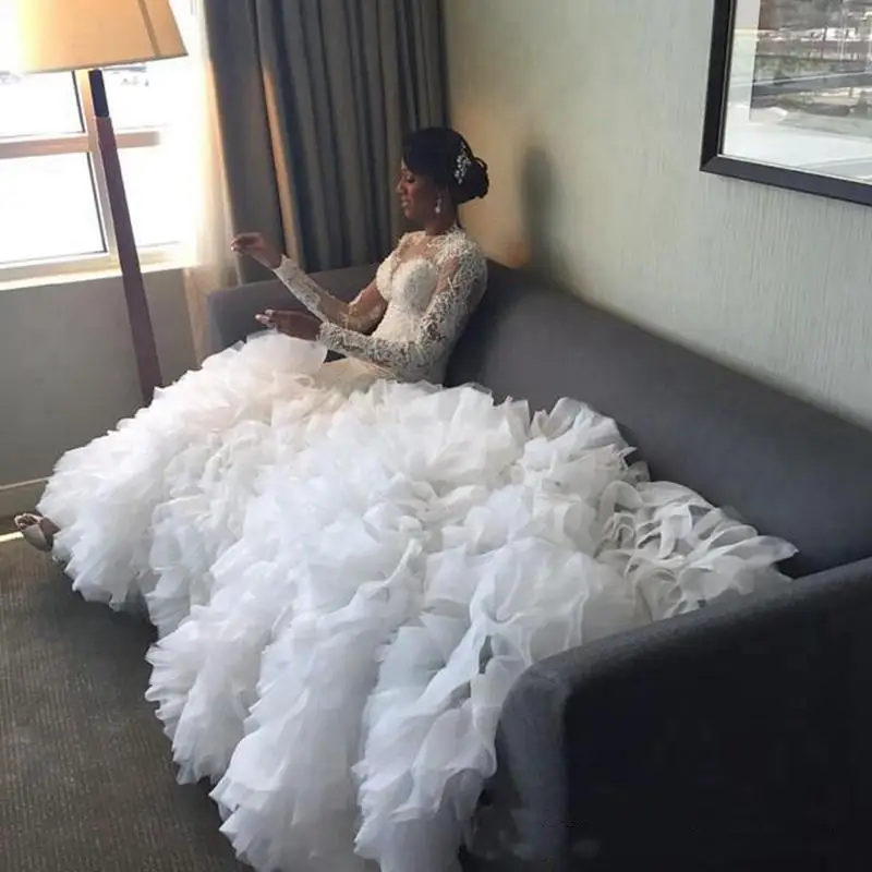 Customized African Long Train Mermaid Wedding Dresses Illusion Lace Full Sleeves Ruffles Tiered Skirt Bride Garden Wedding Dress
Customized African Long Train Mermaid Wedding Dresses Illusion Lace Full Sleeves Ruffles Tiered Skirt Bride Garden Wedding Dress