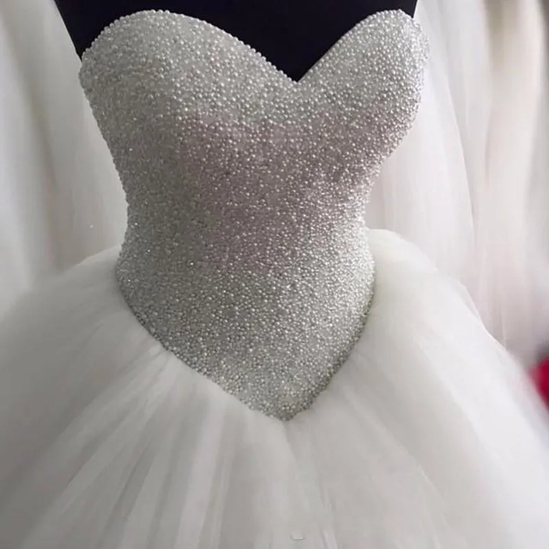 2025 Luxurious Pearls Beaded Wedding Dress Sweetheart Corset Bridal Bride Gowns vestidos de noivas mariage
2025 Luxurious Pearls Beaded Wedding Dress Sweetheart Corset Bridal Bride Gowns vestidos de noivas mariage