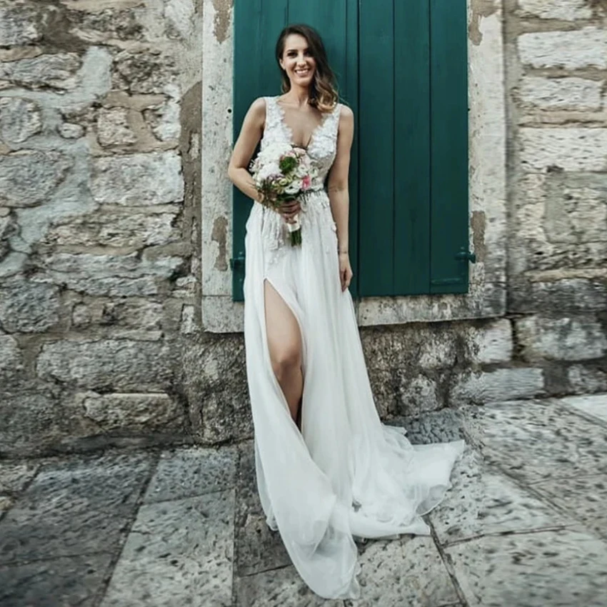 Sexy Boho Wedding Dresses Plus Size Double V Neck Sleeveless Applique Pearls Flowers Chiffon Slit Wedding Gown Vestidos De Novia
Sexy Boho Wedding Dresses Plus Size Double V Neck Sleeveless Applique Pearls Flowers Chiffon Slit Wedding Gown Vestidos De Novia