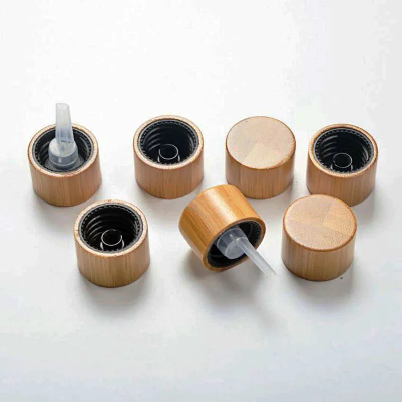 50pcs Bamboo Products Cosmetic Cap 18mm Neck Glass Essential Oil Bottles Bamboo Cover 18/410 Plastic Spiral Drops of plug lid
50pcs Bamboo Products Cosmetic Cap 18mm Neck Glass Essential Oil Bottles Bamboo Cover 18/410 Plastic Spiral Drops of plug lid