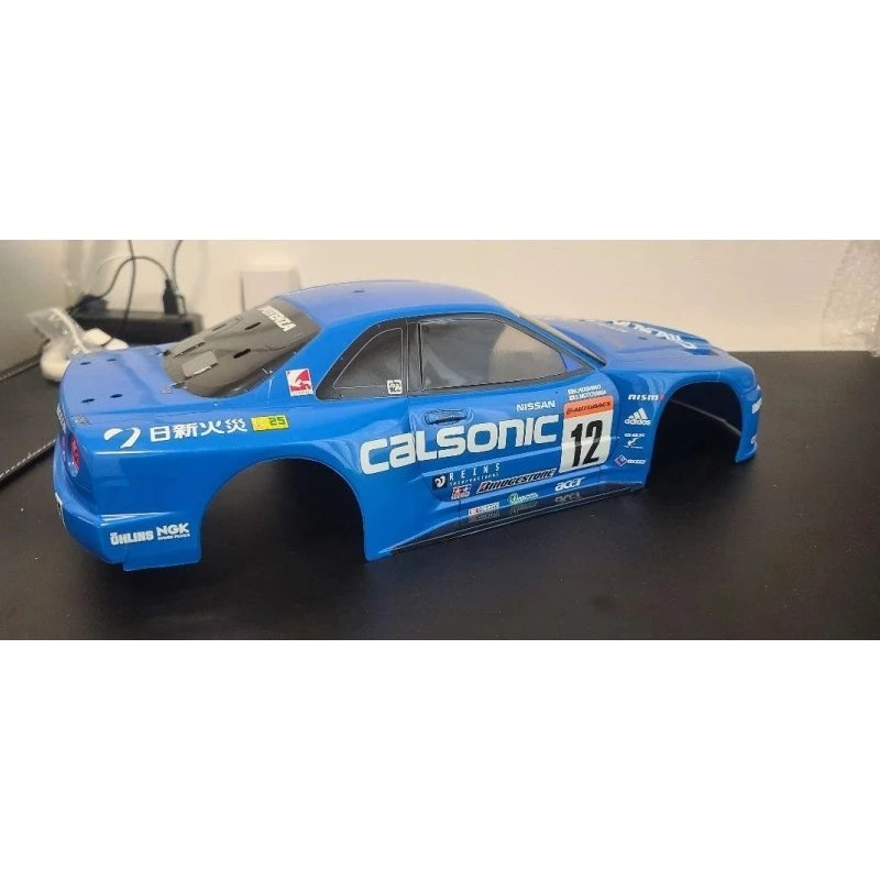 Tamiya Calsonic Gt-R R34 Кузов масштаба 1/10, прозрачный неокрашенный лехаский радиоуправляемый корпус автомобиля
Tamiya Calsonic Gt-R R34 Кузов масштаба 1/10, прозрачный неокрашенный лехаский радиоуправляемый корпус автомобиля