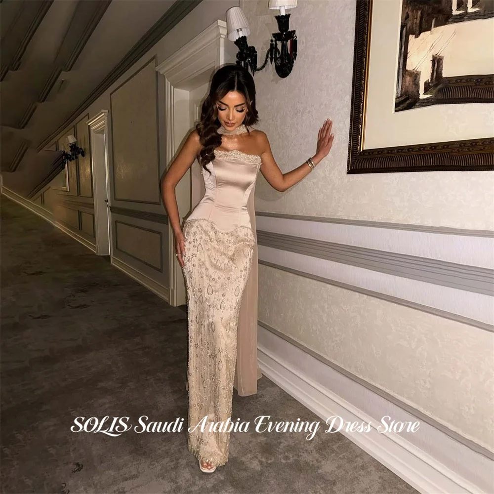 Вечернее платье SOLIS цвета шампань без бретелек, с драпированным шейным платком, вечернее платье с кристаллами, платье для знаменитостей, на заказ
Вечернее платье SOLIS цвета шампань без бретелек, с драпированным шейным платком, вечернее платье с кристаллами, платье для знаменитостей, на заказ