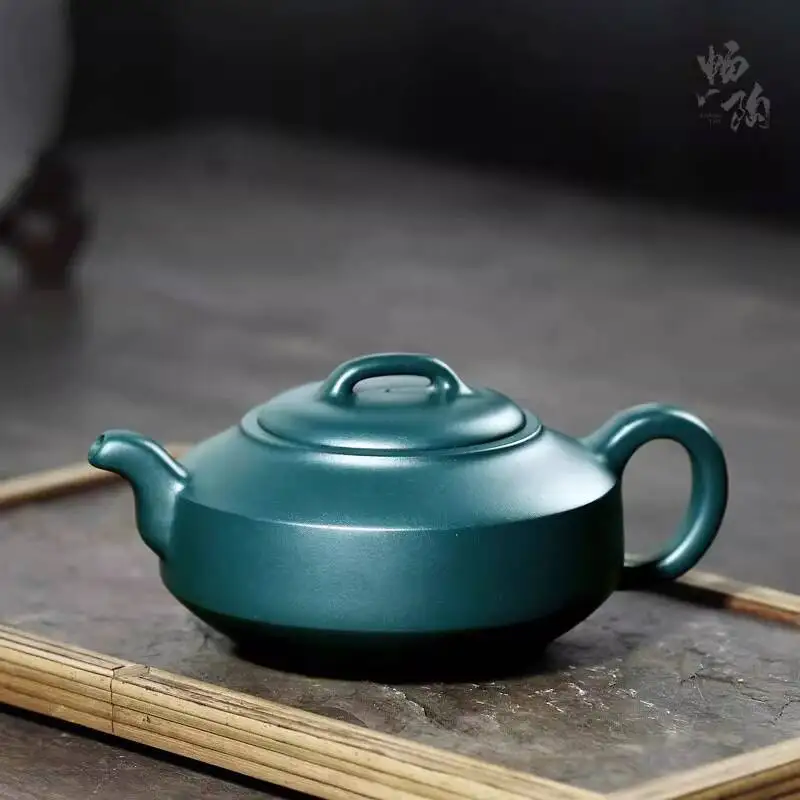 Changtaoyixing Famous Artist Tao Jianquan's Fully Handmade Purple Dark Green Clay Hanjun Teapot, 330Cc
Changtaoyixing Famous Artist Tao Jianquan's Fully Handmade Purple Dark Green Clay Hanjun Teapot, 330Cc