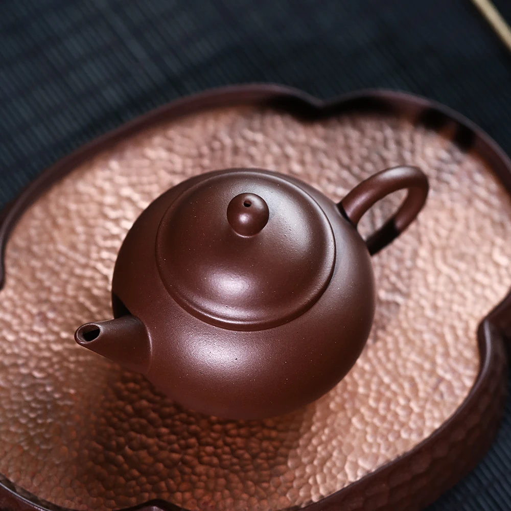 |clay pot pure handmade famous Kung Fu tea set tea pot single pot cultural revolution old purple clay horizontal pot
|clay pot pure handmade famous Kung Fu tea set tea pot single pot cultural revolution old purple clay horizontal pot