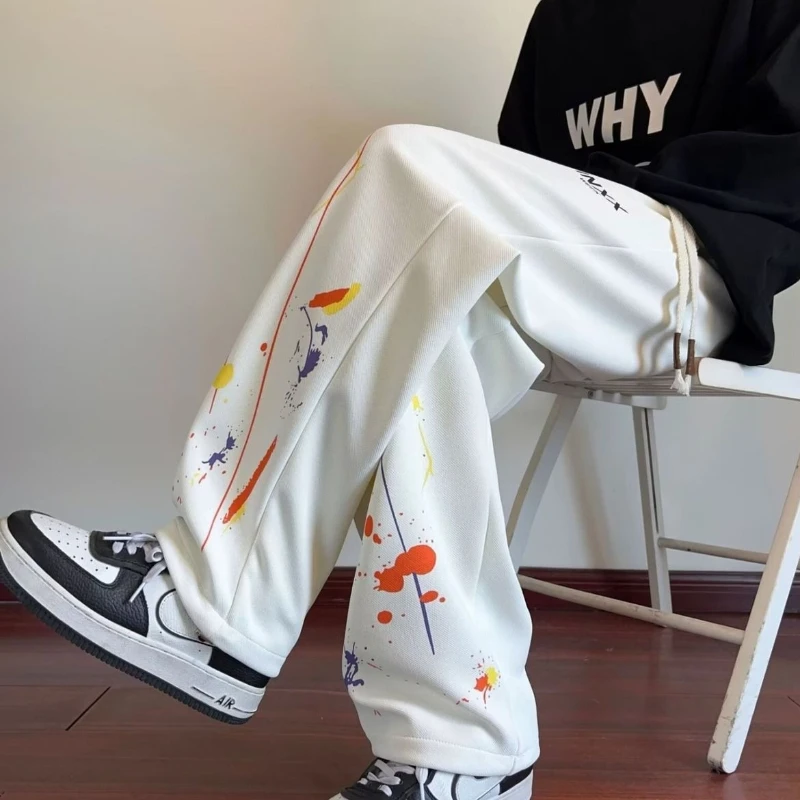 Trendy Men’s Graffiti Jogger Trousers American Street Style Wide Straight Leg Pants Loose Casual Long Pants for Everyday Wear
Trendy Men’s Graffiti Jogger Trousers American Street Style Wide Straight Leg Pants Loose Casual Long Pants for Everyday Wear