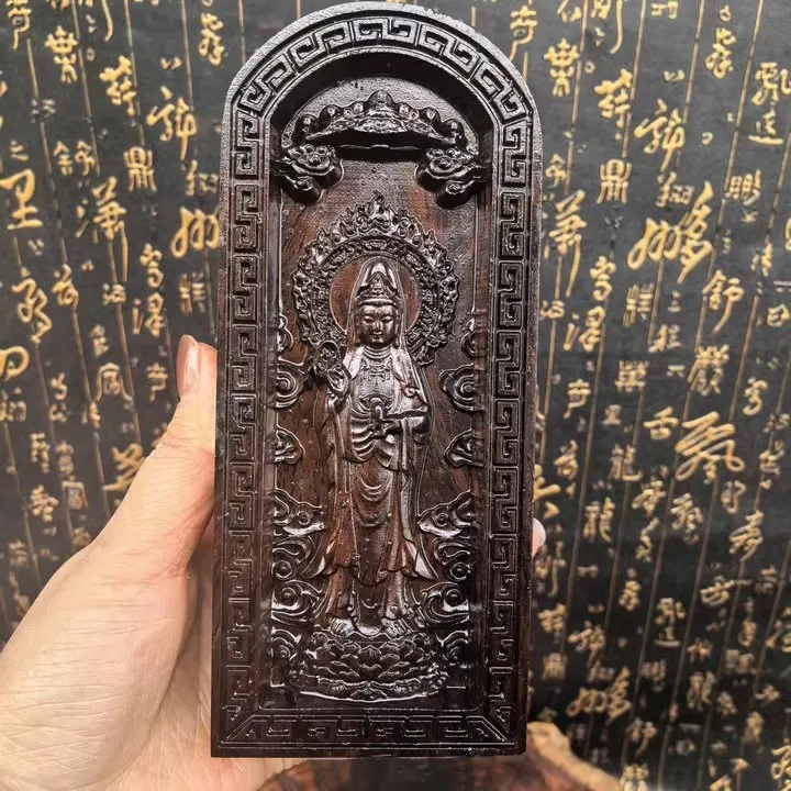Рельефная статуэтка Гуаньинь из черного дерева, культурный артефакт буддистской культуры
Рельефная статуэтка Гуаньинь из черного дерева, культурный артефакт буддистской культуры