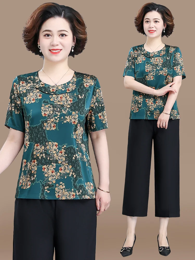 Новый летний комплект из двух предметов: футболка из ледяного шелка и шорты, для женщин среднего возраста, с ретро-узором, круглым вырезом, свободного кроя.
Новый летний комплект из двух предметов: футболка из ледяного шелка и шорты, для женщин среднего возраста, с ретро-узором, круглым вырезом, свободного кроя.