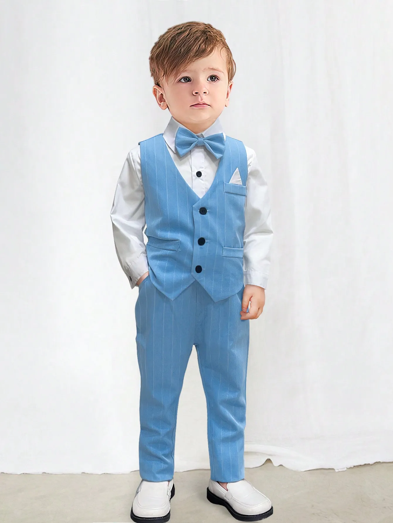 Boys Formal 4-Piece Suit Set: White Shirt, Light Blue Striped Vest & Pants, Bow Tie
Boys Formal 4-Piece Suit Set: White Shirt, Light Blue Striped Vest & Pants, Bow Tie