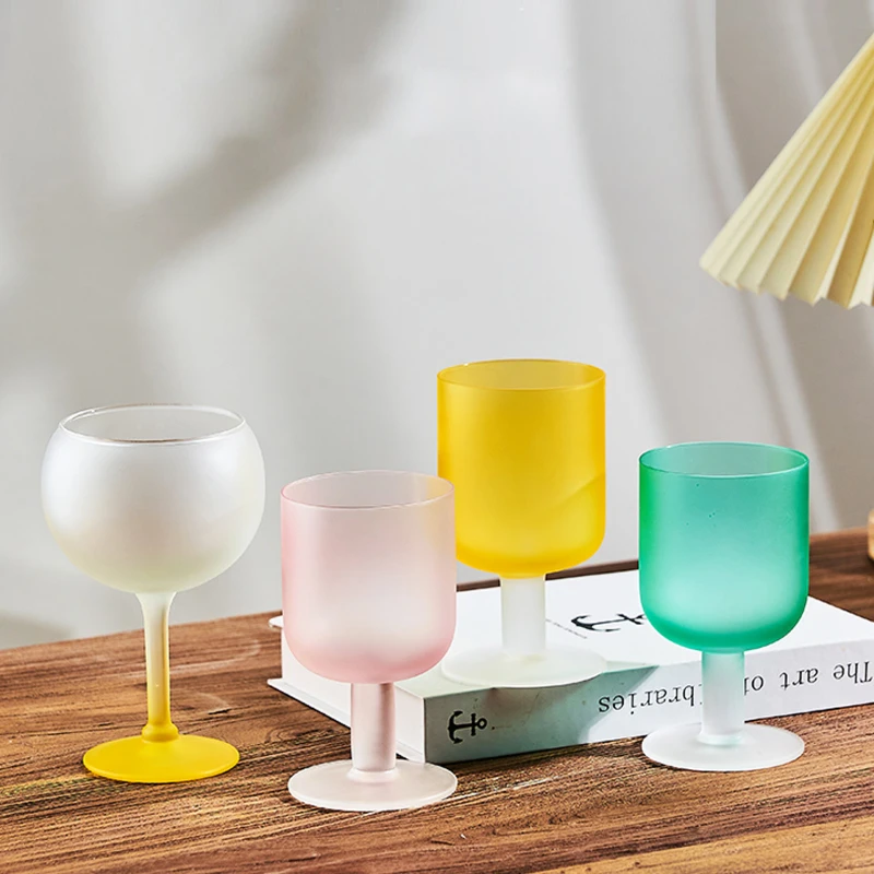 Creative frosted short leg cocktail glass household high-value candy series water glass juice glass red wine sweet wine glass.
Creative frosted short leg cocktail glass household high-value candy series water glass juice glass red wine sweet wine glass.