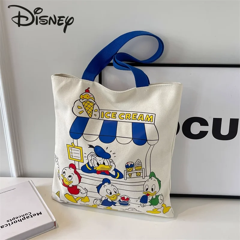 Новая женская сумка для покупок Disney 2024, модная Высококачественная женская сумка, мультяшная Повседневная вместительная сумка через плечо для девушек
Новая женская сумка для покупок Disney 2024, модная Высококачественная женская сумка, мультяшная Повседневная вместительная сумка через плечо для девушек