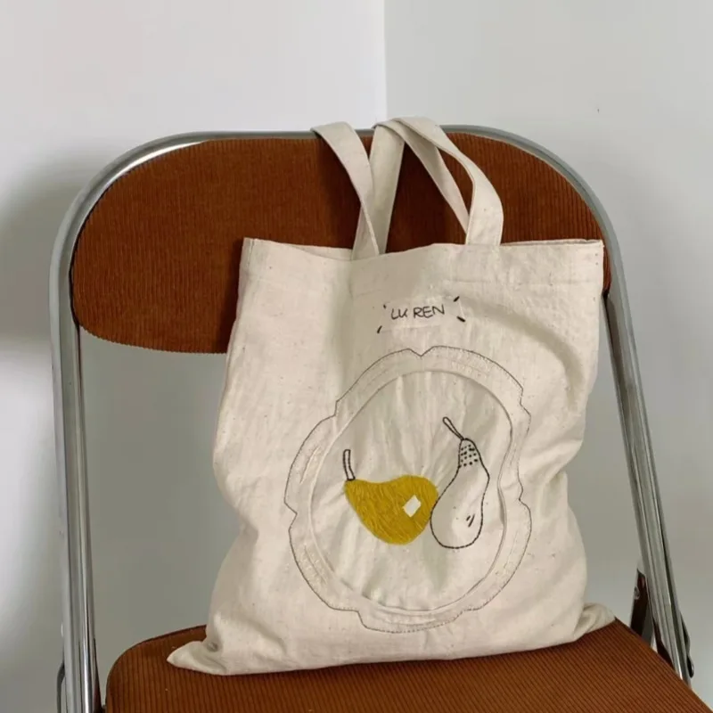 2025 New Japanese Niche Design Embroidered Canvas Bag for Women Large Capacity Shoulder Commuting Hand-held Tote Bags
2025 New Japanese Niche Design Embroidered Canvas Bag for Women Large Capacity Shoulder Commuting Hand-held Tote Bags