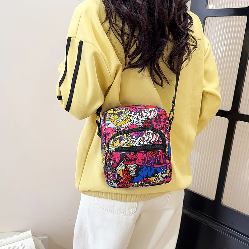Fashionable and colorful, versatile messenger bag, new style graffiti chest bag, modern sports handbag
Fashionable and colorful, versatile messenger bag, new style graffiti chest bag, modern sports handbag