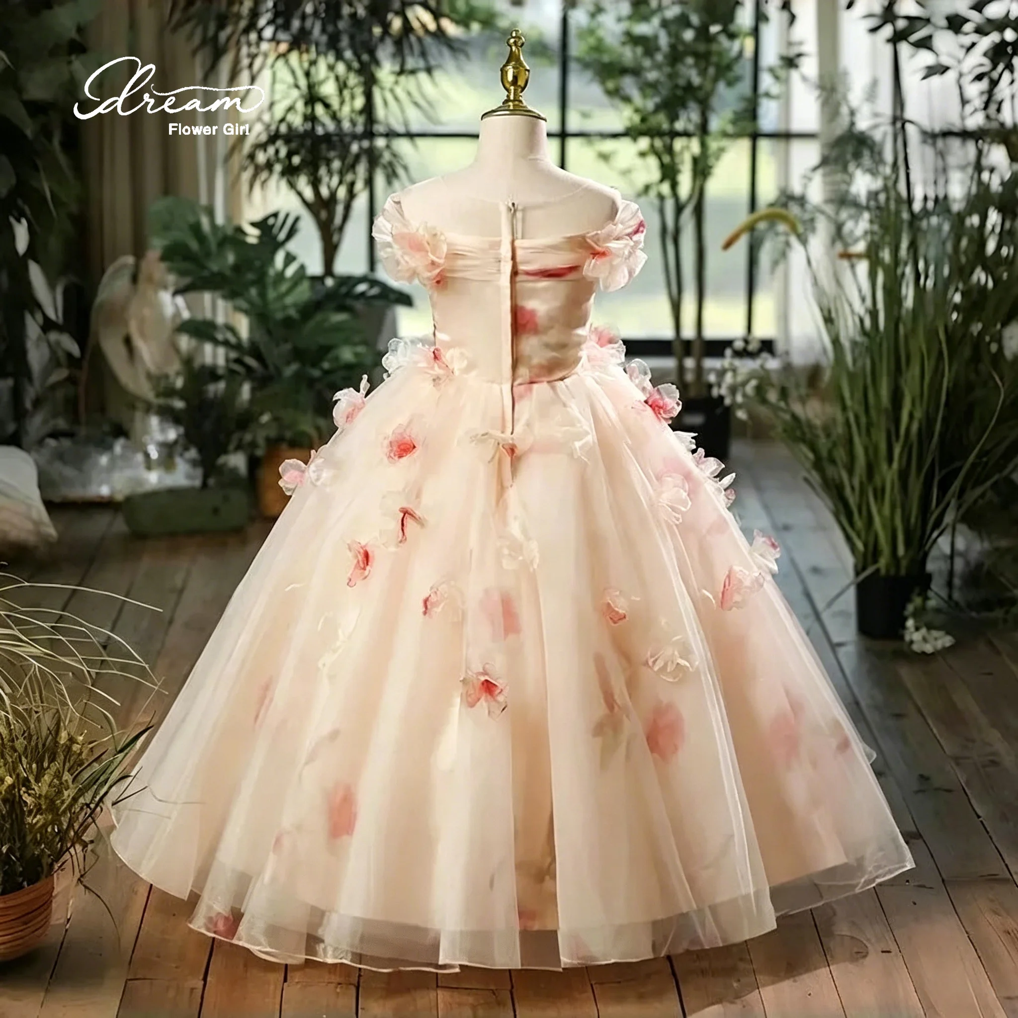 Ivory off-the-shoulder strapless floor-length ball gown for girls featuring a full skirt and a printed pattern
Ivory off-the-shoulder strapless floor-length ball gown for girls featuring a full skirt and a printed pattern