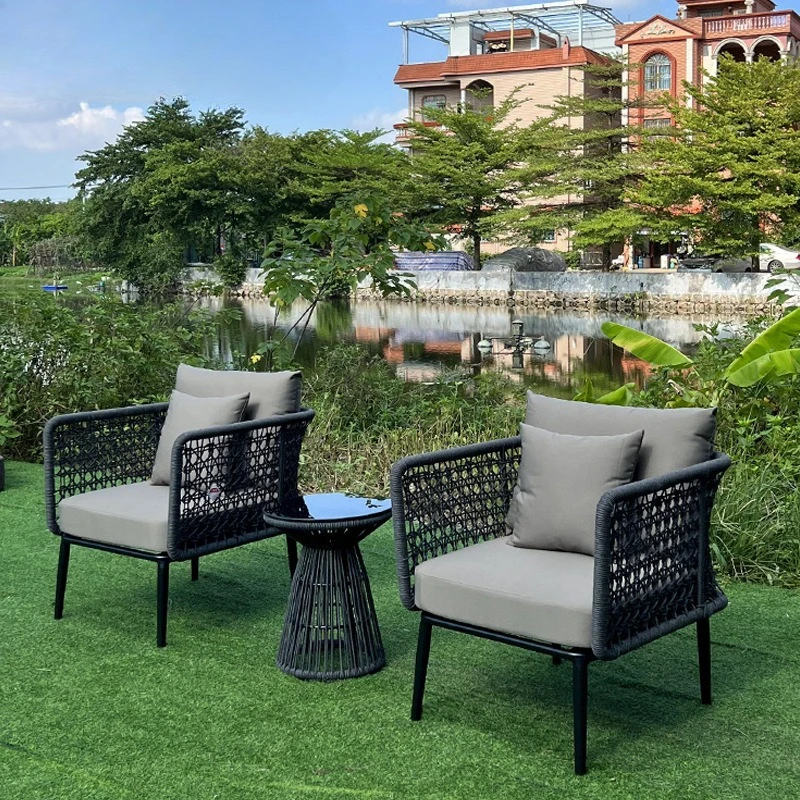 Outdoor simple rope chair small tea table three-piece set living room cafe milk tea shop hand-woven table and chair furniture 
Outdoor simple rope chair small tea table three-piece set living room cafe milk tea shop hand-woven table and chair furniture