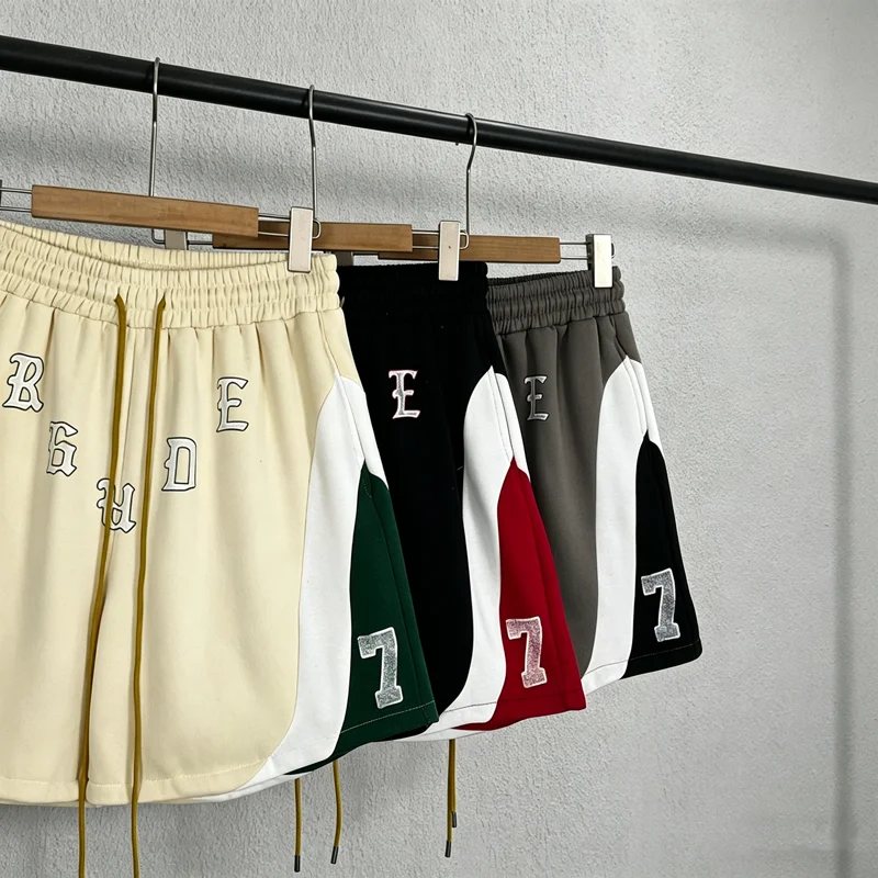 Color Blocking Number 7 Label RHUDE Shorts Men Women High Quality Patchwork Loose Drawstring Yellow Rope Shortpants Breeches
Color Blocking Number 7 Label RHUDE Shorts Men Women High Quality Patchwork Loose Drawstring Yellow Rope Shortpants Breeches
