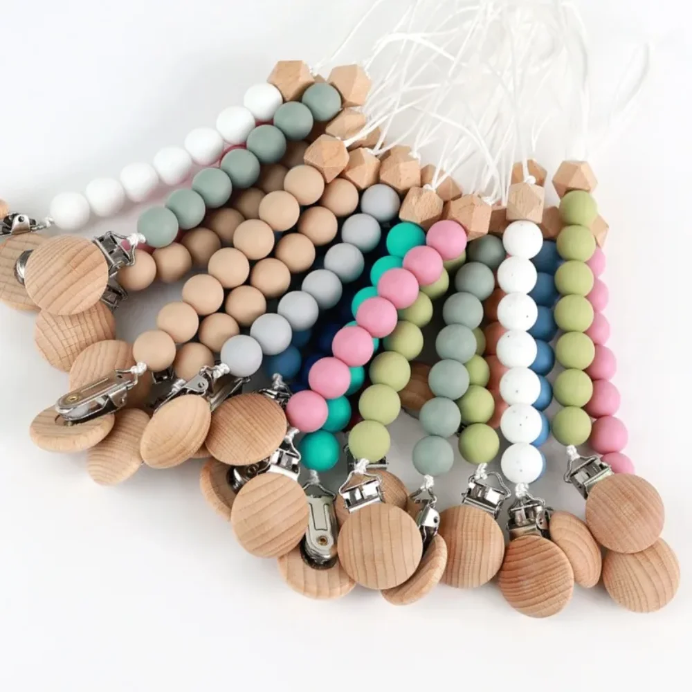 Горячая безопасная игрушка для прорезывания зубов для новорожденных, держатель для соски, зажим для детской соски, деревянный цвет, силиконовая бусина, детская цепочка с защитой от падения, товары
Горячая безопасная игрушка для прорезывания зубов для новорожденных, держатель для соски, зажим для детской соски, деревянный цвет, силиконовая бусина, детская цепочка с защитой от падения, товары