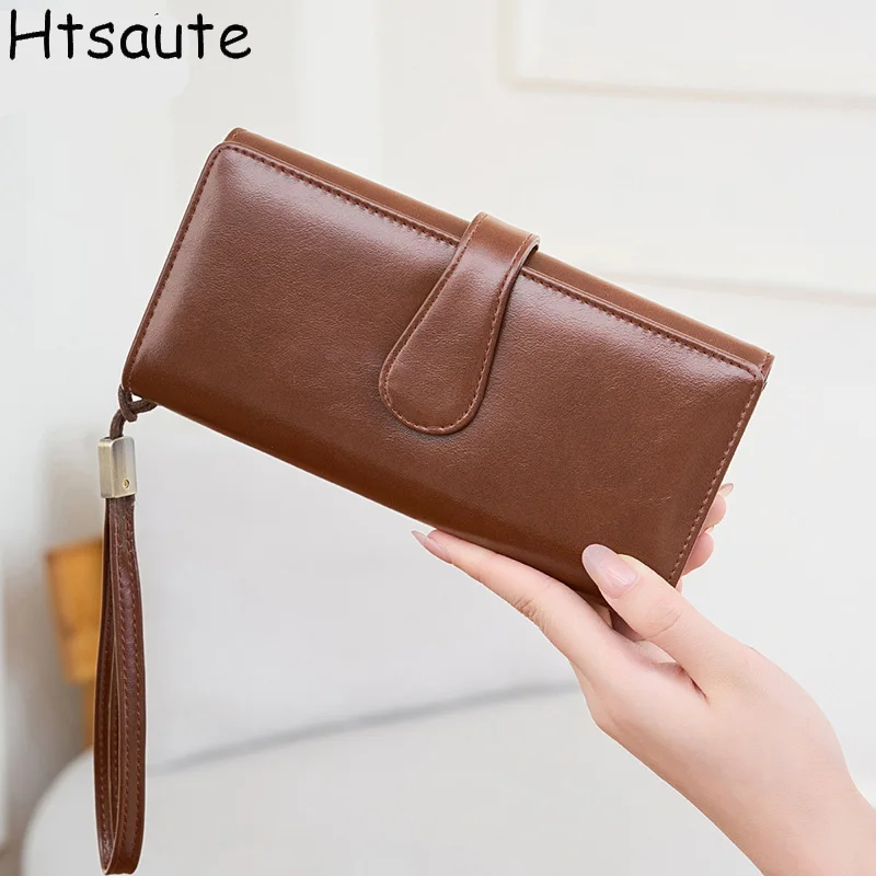 Элегантный однотонный кошелек-клатч из искусственной кожи с ремешком на запястье для женщин, кошельки с отстегивающимся отделением, винтажный кошелек с застежкой-защелкой.
Элегантный однотонный кошелек-клатч из искусственной кожи с ремешком на запястье для женщин, кошельки с отстегивающимся отделением, винтажный кошелек с застежкой-защелкой.