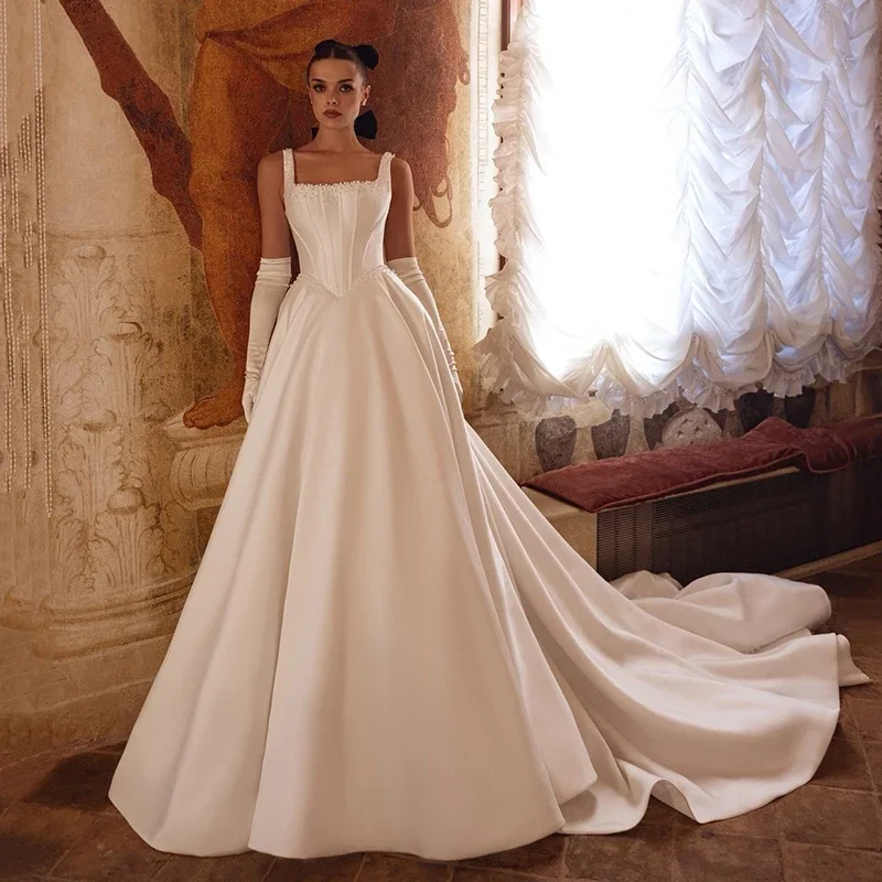 Атласные свадебные платья трапециевидной формы по индивидуальному заказу с пышными бретельками, платье невесты, сексуальное платье с открытой спиной, платье de novia robe de mariée
Атласные свадебные платья трапециевидной формы по индивидуальному заказу с пышными бретельками, платье невесты, сексуальное платье с открытой спиной, платье de novia robe de mariée