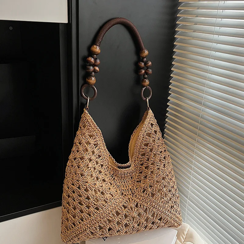 Bohemian Hollow Crochet Woven Tote Bag with Wooden Bead Handle Large Capacity Handmade Straw Shoulder Bag for Women Casual Beach
Bohemian Hollow Crochet Woven Tote Bag with Wooden Bead Handle Large Capacity Handmade Straw Shoulder Bag for Women Casual Beach