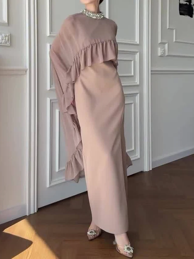 Элегантный блестящий топ с накидкой и длинной юбкой с круглым вырезом, женский повседневный однотонный костюм без рукавов для вечеринок, модный костюм из двух предметов с разрезом и рюшами
Элегантный блестящий топ с накидкой и длинной юбкой с круглым вырезом, женский повседневный однотонный костюм без рукавов для вечеринок, модный костюм из двух предметов с разрезом и рюшами