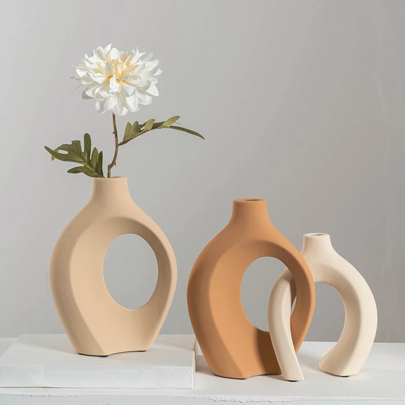 Creative light luxury plain color art ceramic vase set combination home living room ornament simple decoration vases 
Creative light luxury plain color art ceramic vase set combination home living room ornament simple decoration vases