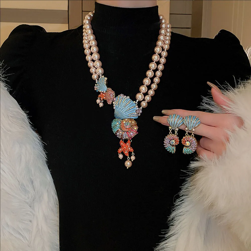 Vintage Crystal-encrusted Shell Star Double-layer Pearl Necklace Earrings Set Light Luxury style Creative Niche Fashion Jewelry
Vintage Crystal-encrusted Shell Star Double-layer Pearl Necklace Earrings Set Light Luxury style Creative Niche Fashion Jewelry