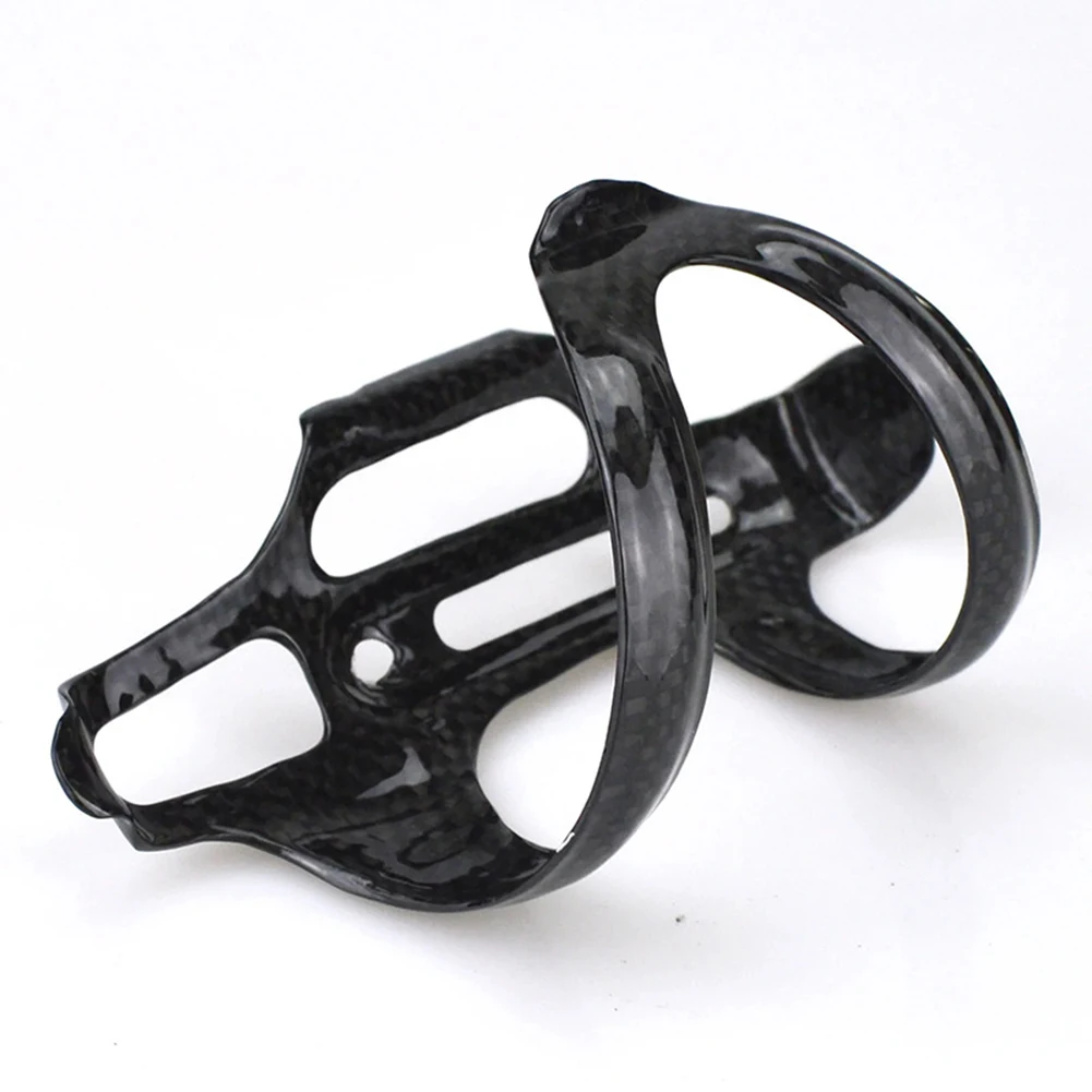 Stylish Carbon Fiber Water Bottle Cage Right Side Open Design Perfect for Mountain/Road/Folding Bikes 140MM*74MM*65MM Size
Stylish Carbon Fiber Water Bottle Cage Right Side Open Design Perfect for Mountain/Road/Folding Bikes 140MM*74MM*65MM Size