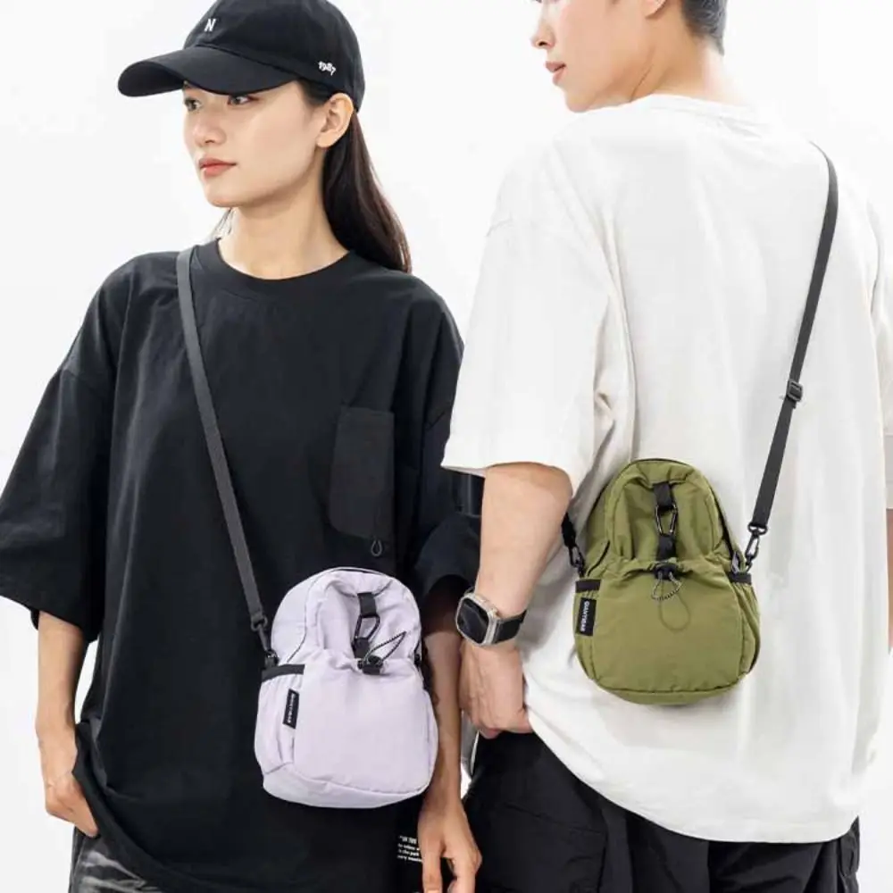 Harajuku Sports Nylon Shoulder Bag Coin Pouch Casual Drawstring Crossbody Bag Solid Color Korean Style Mobile Phone Pack Travel
Harajuku Sports Nylon Shoulder Bag Coin Pouch Casual Drawstring Crossbody Bag Solid Color Korean Style Mobile Phone Pack Travel