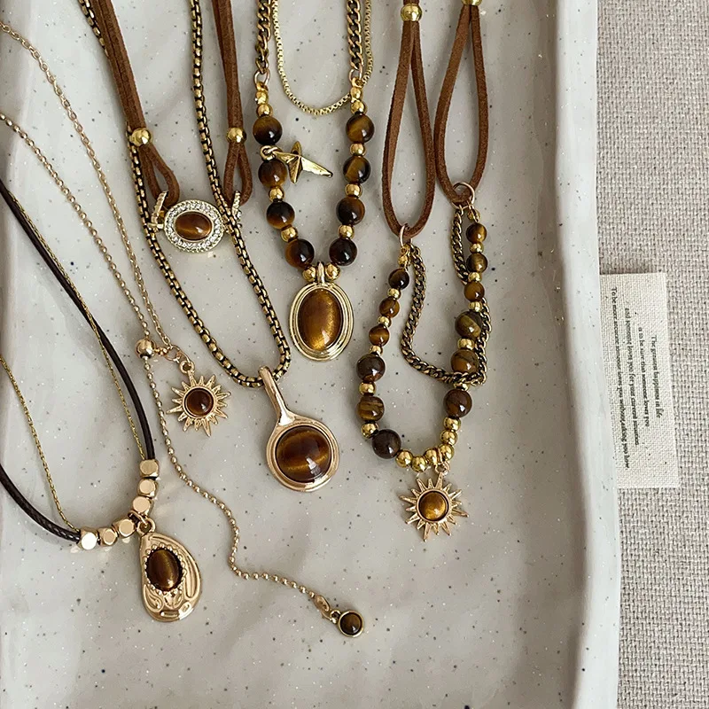 Boho Tiger Eye Necklaces for Women Retro Natural Stone Pendant Necklaces Gold Layered Choker Jewelry Gifts 
Boho Tiger Eye Necklaces for Women Retro Natural Stone Pendant Necklaces Gold Layered Choker Jewelry Gifts