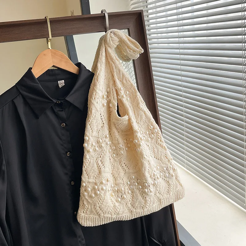 Летние каникулы с жемчугом, женские вязаные сумки на плечо, большая вместительная женская пляжная сумка, повседневная полая дизайнерская женская сумка-тоут под мышками
Летние каникулы с жемчугом, женские вязаные сумки на плечо, большая вместительная женская пляжная сумка, повседневная полая дизайнерская женская сумка-тоут под мышками