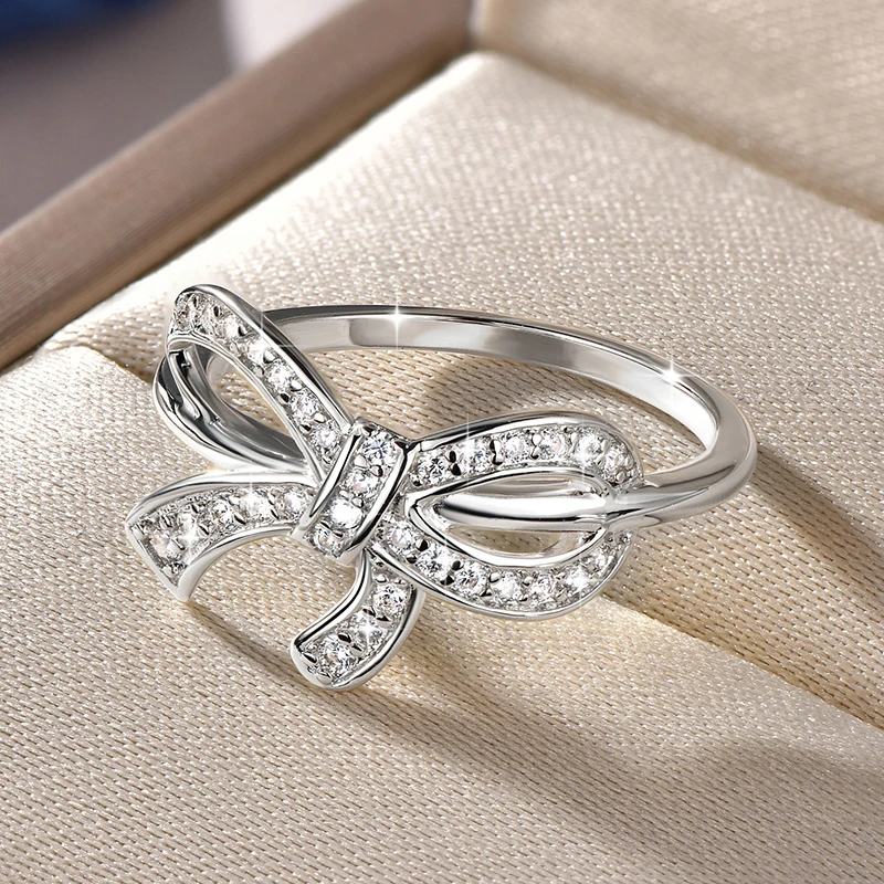 Women's Bow Knot Cubic Zirconia Ring Paved 1.15-1.5mm Round CZ Statement Ring Elegant Copper Bow Ring for Daily & Occasion Wear
Women's Bow Knot Cubic Zirconia Ring Paved 1.15-1.5mm Round CZ Statement Ring Elegant Copper Bow Ring for Daily & Occasion Wear