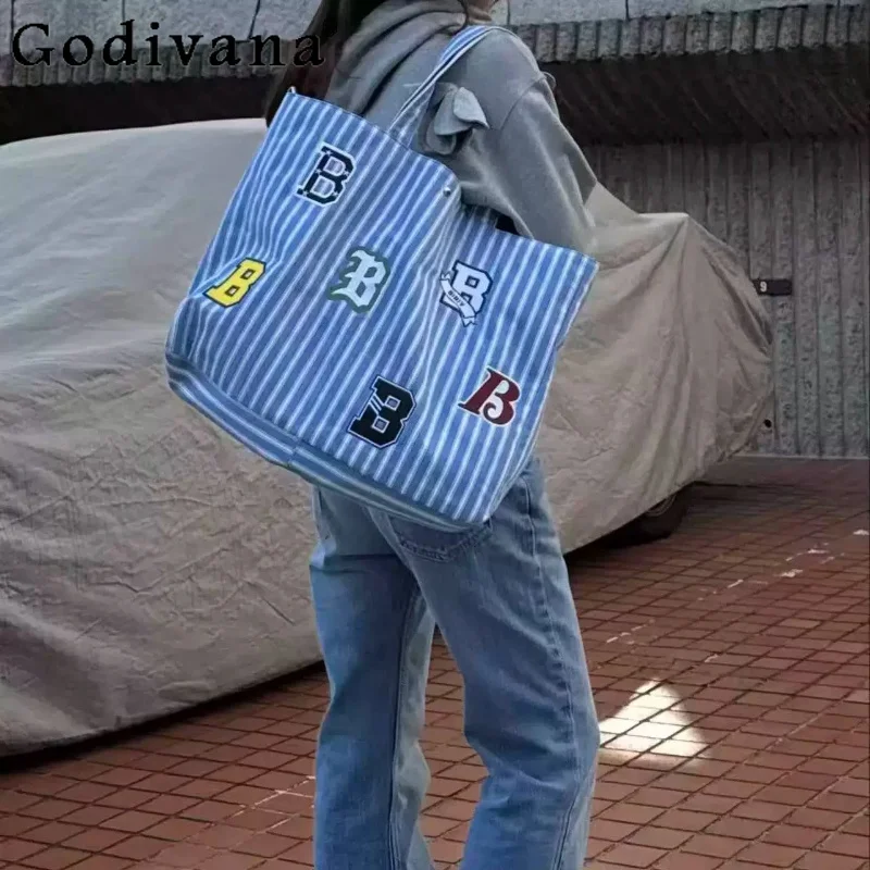 2026 Japanese Style Large Capacity Tote Bag Female Casual Canvas Stripes Letter Embroidered Patch Crossbody Shoulder Bags Women
2026 Japanese Style Large Capacity Tote Bag Female Casual Canvas Stripes Letter Embroidered Patch Crossbody Shoulder Bags Women