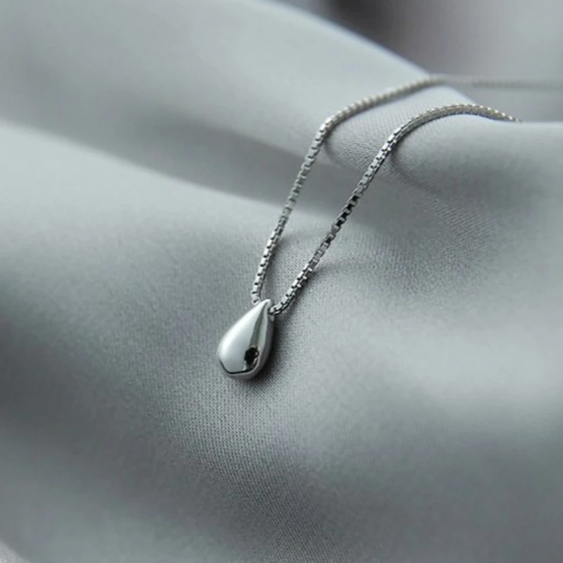 Новое ожерелье из стерлингового серебра 925 пробы, изысканный кулон в форме капли воды для женщин, модные благородные свадебные украшения, аксессуары, подарки на вечеринку
Новое ожерелье из стерлингового серебра 925 пробы, изысканный кулон в форме капли воды для женщин, модные благородные свадебные украшения, аксессуары, подарки на вечеринку
