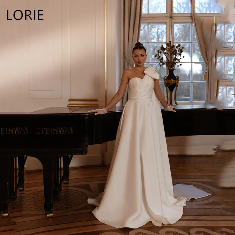 LORIE Big Bow Wedding Dresses A-Line Single shoulder Side Slit Draped Bride Prom Gown Floor-Length Bridal Gowns 2025 Customized
LORIE Big Bow Wedding Dresses A-Line Single shoulder Side Slit Draped Bride Prom Gown Floor-Length Bridal Gowns 2025 Customized