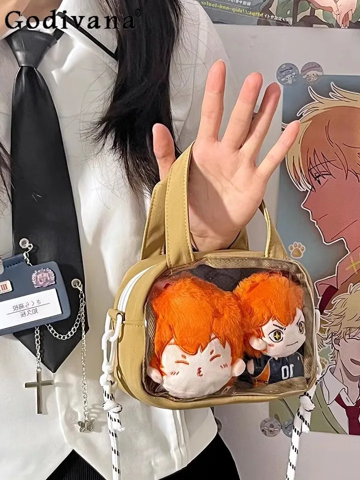 Милая ретро милая крутая маленькая вместительная сумка Ita-bag, сумка для куклы, прозрачная унисекс, студенческая повседневная универсальная сумка-мессенджер
Милая ретро милая крутая маленькая вместительная сумка Ita-bag, сумка для куклы, прозрачная унисекс, студенческая повседневная универсальная сумка-мессенджер