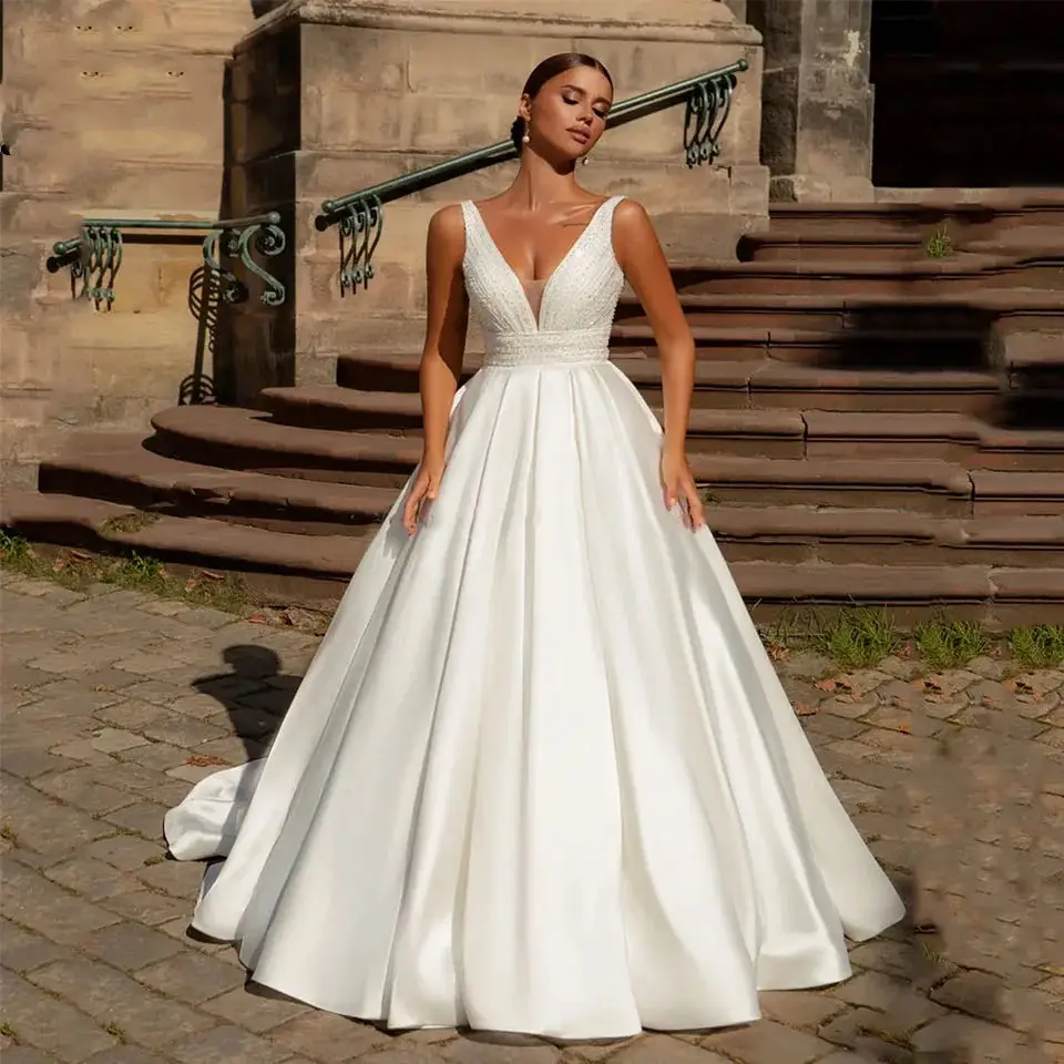 Luxury Beading Satin Wedding Dresses Sexy V Neck Sleeveless Sequin Custom Size 2024 Ball Gown Corset Bridal Gown Robe Mariage
Luxury Beading Satin Wedding Dresses Sexy V Neck Sleeveless Sequin Custom Size 2024 Ball Gown Corset Bridal Gown Robe Mariage