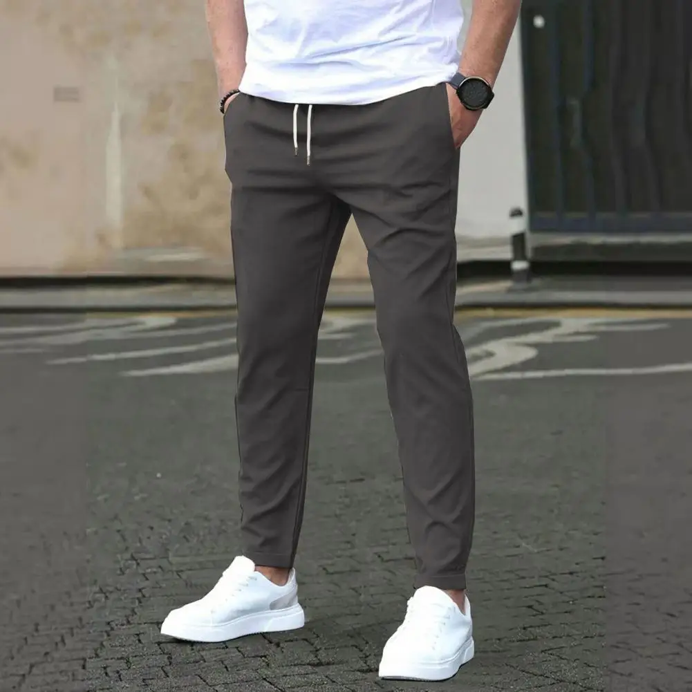 Men Trousers Stylish Men's Slim Fit Drawstring Pants with Side Pockets for Commuting Travel Gym Elastic Waist Casual Trousers
Men Trousers Stylish Men's Slim Fit Drawstring Pants with Side Pockets for Commuting Travel Gym Elastic Waist Casual Trousers