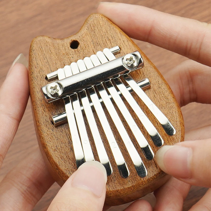 8 Keys Mini Kalimba Wooden Thumb Piano With Lanyard Portable Finger Piano Musical Instrument Gift Set For Kids And Adults
8 Keys Mini Kalimba Wooden Thumb Piano With Lanyard Portable Finger Piano Musical Instrument Gift Set For Kids And Adults